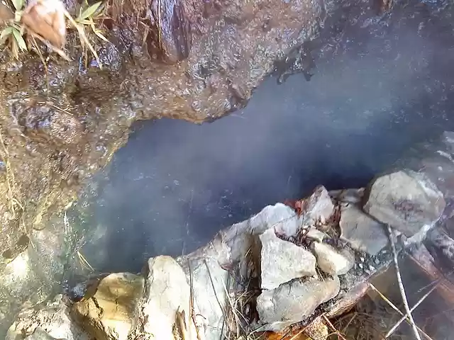 Bubbling out at 200 degrees,  Belknap Hot Springs
